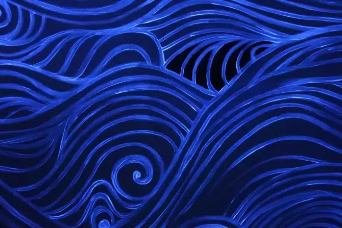 Des vagues peintes qui brillent sous la lumière noire